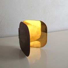 a yellow object sitting on top of a white table