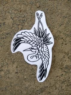 a sticker depicting a bird with feathers on it's head is shown in black and white