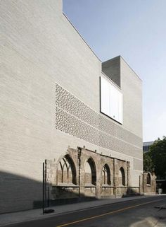 an old building with arched windows on the side