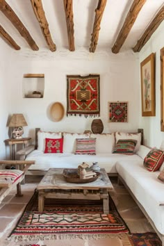 a living room filled with lots of furniture and decor on top of it's walls