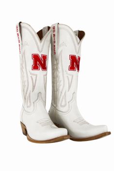 Women's Collegiate Gameday Boots in Ivory Details Available in sizes 5 - 13 INCLUDING 1/2 SIZES Premium Geniune Ivory Leather Goodyear Welt Construction Memory Foam Insole Smooth Leather Lining Natural Stacked Wood Heel Western Embroidery Stitching Embroidered Team Logos Snip-toe Pull on Style with V Front and Back 14" Shaft Height and Circumference CLC Approved Sizing Sizes 5 - 13 to include 1/2 sizes! Fit Boots run 1/2 size small. Size up 1/2 size. Western Cream Boots With Reinforced Heel, Western Style Cream Boots With Reinforced Heel, Cream Western Boots With Reinforced Heel, White Leather Knee-high Boots With Snip Toe, Western White Snip Toe Knee-high Boots, Western Cream Ankle Boots, Western White Mid-calf Boots With Reinforced Heel, Western Style Cream Ankle Boots, Cream Boots With Reinforced Heel And Snip Toe