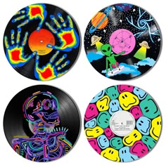 three different colored records with designs on them