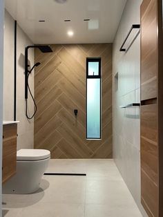 a modern bathroom with wood and tile walls