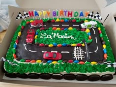 a birthday cake in the shape of a race track