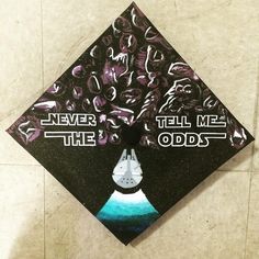 a graduation cap with the words never tell me odds on it