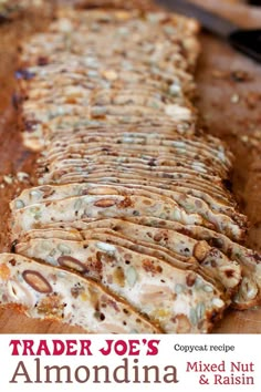 the cover of trader joe's almond nut and raisin bread is shown on a cutting board