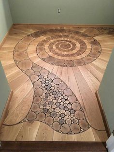 a wooden floor with circular designs on the top and bottom part inlayed to it