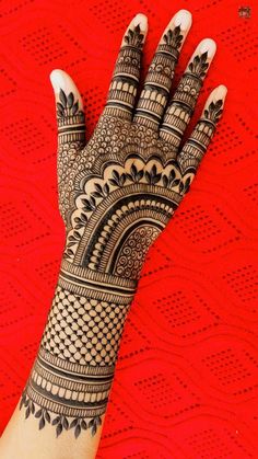 the hand is decorated with intricate designs