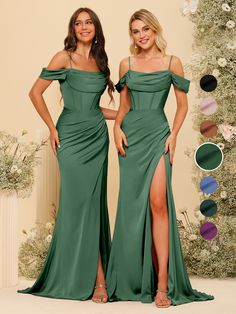 two women in green dresses standing next to each other with their hands on their hips