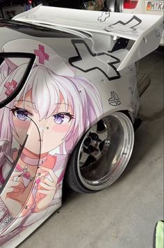 a car painted with anime characters on it