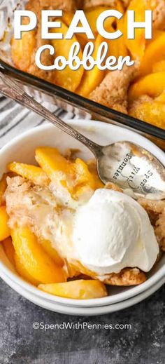 peach cobbler in a bowl with ice cream on top and a serving spoon next to it