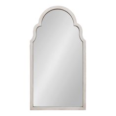 an arched mirror on a white wall