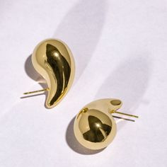 TEARDROP EARRINGS There is beauty in simplicity and these earrings are simply marvelous! A pair of bold statement earrings you will want to wear every day.  Our Teardrop Earrings are 18K gold plated stainless steel. We use a process called PVD plating, which is the same process used by watch companies. PVD plating tends to be more durable and longer lasting than the industry standard gold plating.  Sold as a pair. DESCRIPTION: - PVD Gold Plating - Stainless Steel - Hypoallergenic Post APPROXIMATE MEASUREMENTS: ► Small Teardrop:      - Earring Length: 0.83" (21 mm)      - Earring Width: 0.47" (12 mm)      - Earring Weight (1): 2.46 grams ► Medium Teardrop:      - Earring Length: 1.06" (27 mm)      - Earring Width: 0.59" (15 mm)      - Earring Weight (1): 3.91 grams ► Large Teardrop:      - Dome Earrings, Tear Drop Earrings, Gift Ideas For Women, Watch Companies, Tear Drop, Teardrop Earrings, Earring Gifts, Gold Plating, Statement Earrings