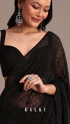 Elevate your evening with this black georgette saree featuring heavy embroidery and stunning stone work.
The intricate details and dramatic black color make it ideal for any highprofile occasion where elegance meets glamour.