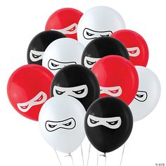 a bunch of red and white balloons with masks on them, all in the same color