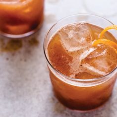 an orange slice is on top of the drink