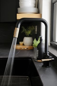 a kitchen faucet with water running from it