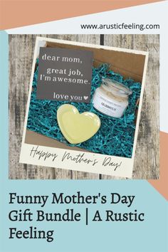 a mother's day gift box with a heart shaped cookie