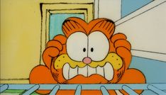 an orange and white cartoon character sitting in front of a door with his mouth open