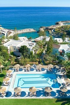 an aerial view of the pool and beach