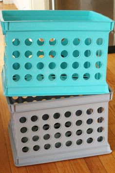 two plastic baskets stacked on top of each other