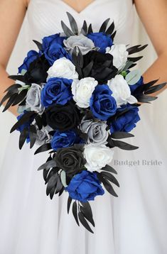 a bride holding a blue and white bouquet