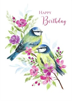 two birds sitting on top of a branch with flowers