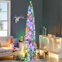 a brightly lit christmas tree in a living room