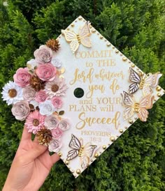 someone is holding up a graduation cap with flowers on it that says, commit the joy whatever you do and your plans will spread