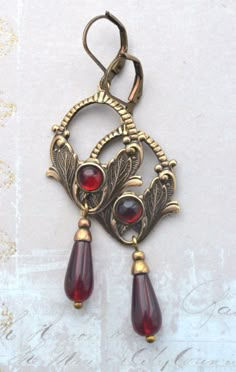 VINTAGE ELEMENTS Unique Jewellery, Handmade from Vintage Inspired Original Designs Art Nouveau style antiqued gold brass Floral Earrings with Red Glass drops  and corresponding Glass Cabochon detail. These earrings have antiqued brass leverback earwires and measure 6.cm from the top of the earwires. Antique Jewelry Silver, Red And Gold Earrings, Metal Smithing Jewelry, Whimsigoth Earrings, Gold Antique Jewellery, Art Nouveau Fashion, Antique Brass Jewelry, Art Deco Accessories, Antique Gold Earrings