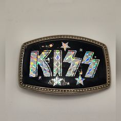 This Is A Collectible And Vintage Kiss Rock Band Belt Buckle With The Silver Prism Logo And Stars And Planets. Circa 1977 Or 1978. It's Stamped 681 On The Back. Is Has Slight Wear And Some Scratches On It. It's In Pretty Good Condition Considering How Old It Is. There Were Silver, Gold, Red, Green, Yellow, And Pink Version's Made At The Time. It's Definitely Vintage And A Rare Piece. Perfect For Hard-Core Kiss Fans, Collectors, Or Anyone Who Wants To Own A Piece Of Rock & Roll History. Look Arou Prism Logo, Kiss Rock Band, Rock And Roll History, Vintage Kiss, Vintage Belt Buckles, Vintage Belt, Vintage Band, Rock Roll, Rock Band