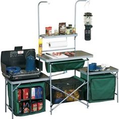 an outdoor cooking station with two trays on the top and one holding food in it