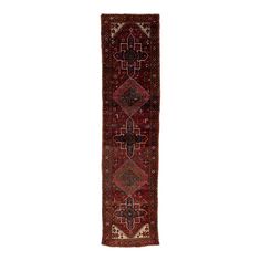 an antique persian runner rug with geometric design