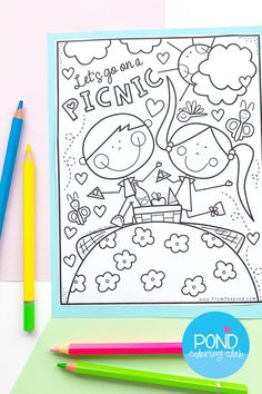 a coloring book with two kids on it and some colored pencils next to it