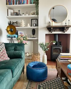 a living room filled with furniture and bookshelves next to a fire hydrant