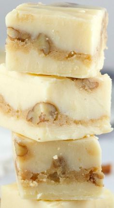 three pieces of white chocolate with walnuts on top