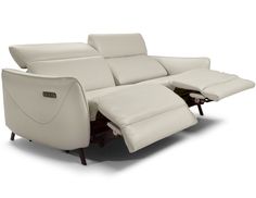 the reclining sofa is white leather and has two recliners on each side