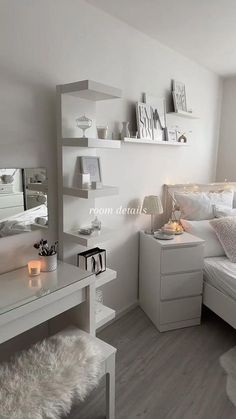 a bedroom with white furniture and decor in it