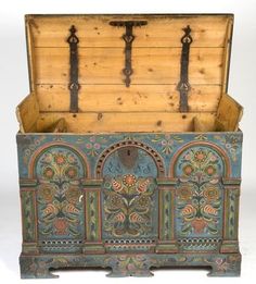 an old wooden box with ornate designs on it