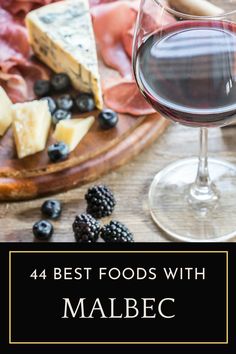 a glass of red wine and cheese on a wooden table with the words, 4 best foods with malbec