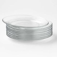 stack of clear glass plates on white background