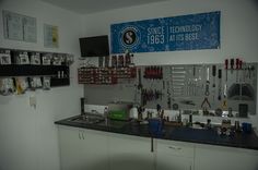 there is a kitchen with many tools on the wall