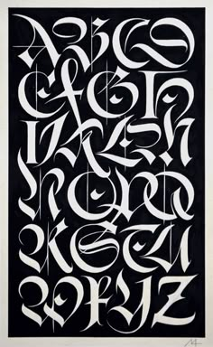 a black and white poster with some type of lettering on it's side, in the