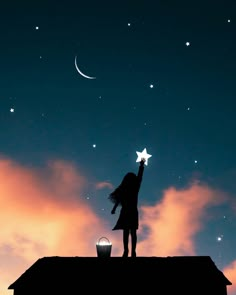 a girl is standing on top of a roof and reaching up to the stars in the sky