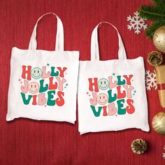 two white bags with holly vibes on them