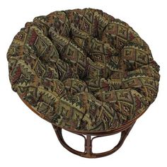 a round chair cushion on top of a wooden stand with the words blazing needles above it