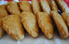 several pastries are lined up on a plate