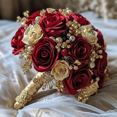 a bridal bouquet with red roses and pearls