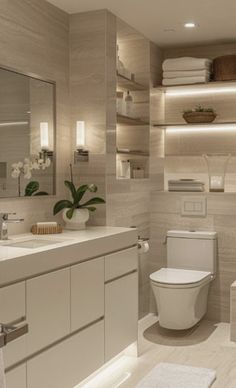 a modern bathroom with white fixtures and beige walls, along with shelving above the toilet