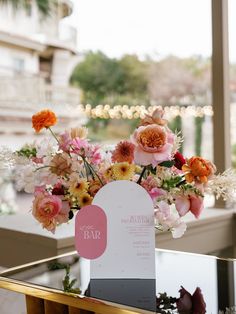 a vase filled with flowers sitting on top of a table